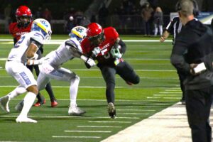 Kilgore's Isaiah Watters fights for yards against Chapel Hill in a playoff game between the schools at Longview's Lobo Stadium last December. Yet another game - the seventh meeting between the schools since October, 2021 - is set for Oct. 11, in Chapel Hill. It made Dave Campbell's Texas Football's top 25 list of must-see high school district games across the state this upcoming season. (Photo by DENNIS JACOBS - ETBLITZ.COM)