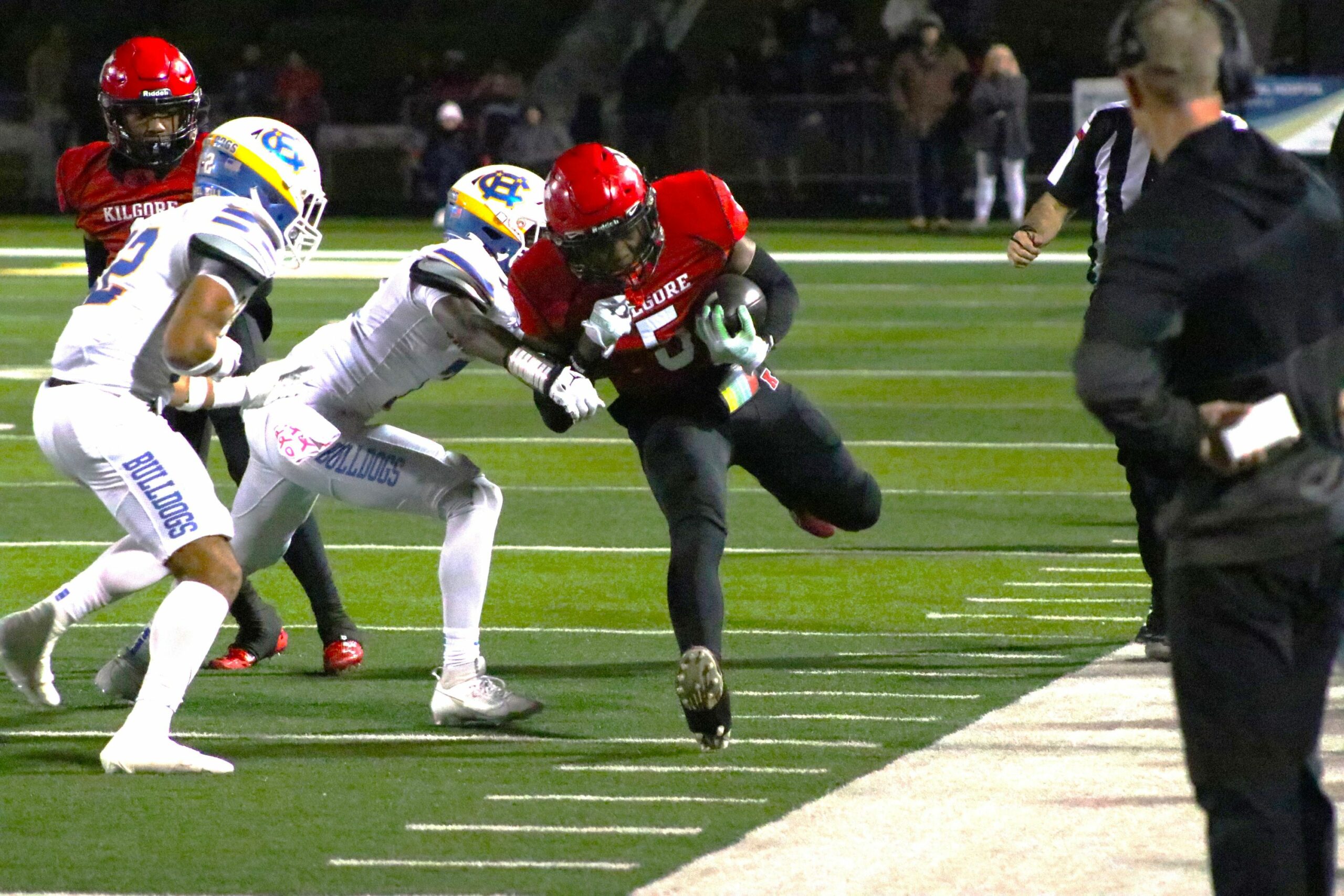 Kilgore's Isaiah Watters fights for yards against Chapel Hill in a playoff game between the schools at Longview's Lobo Stadium last December. Yet another game - the seventh meeting between the schools since October, 2021 - is set for Oct. 11, in Chapel Hill. It made Dave Campbell's Texas Football's top 25 list of must-see high school district games across the state this upcoming season. (Photo by DENNIS JACOBS - ETBLITZ.COM)