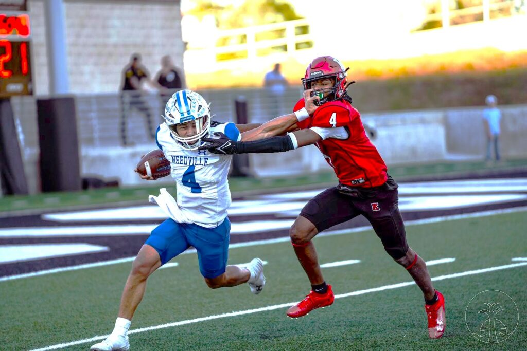 Kilgore's Zaylon Stoker is shown here in a battle with Needville's quarterback in a UIL Class 4A third-round playoff game last fall. Stoker, teammates Braydon Nelson, Cam Christian and Malachi Pierce, and Henderson center Brock Johnson have been named to the 2023 Blue Bell Texas Sports Writers Association's 4A All-State Football Team. (Photo by ALEX NABOR - ETBLITZ.COM)