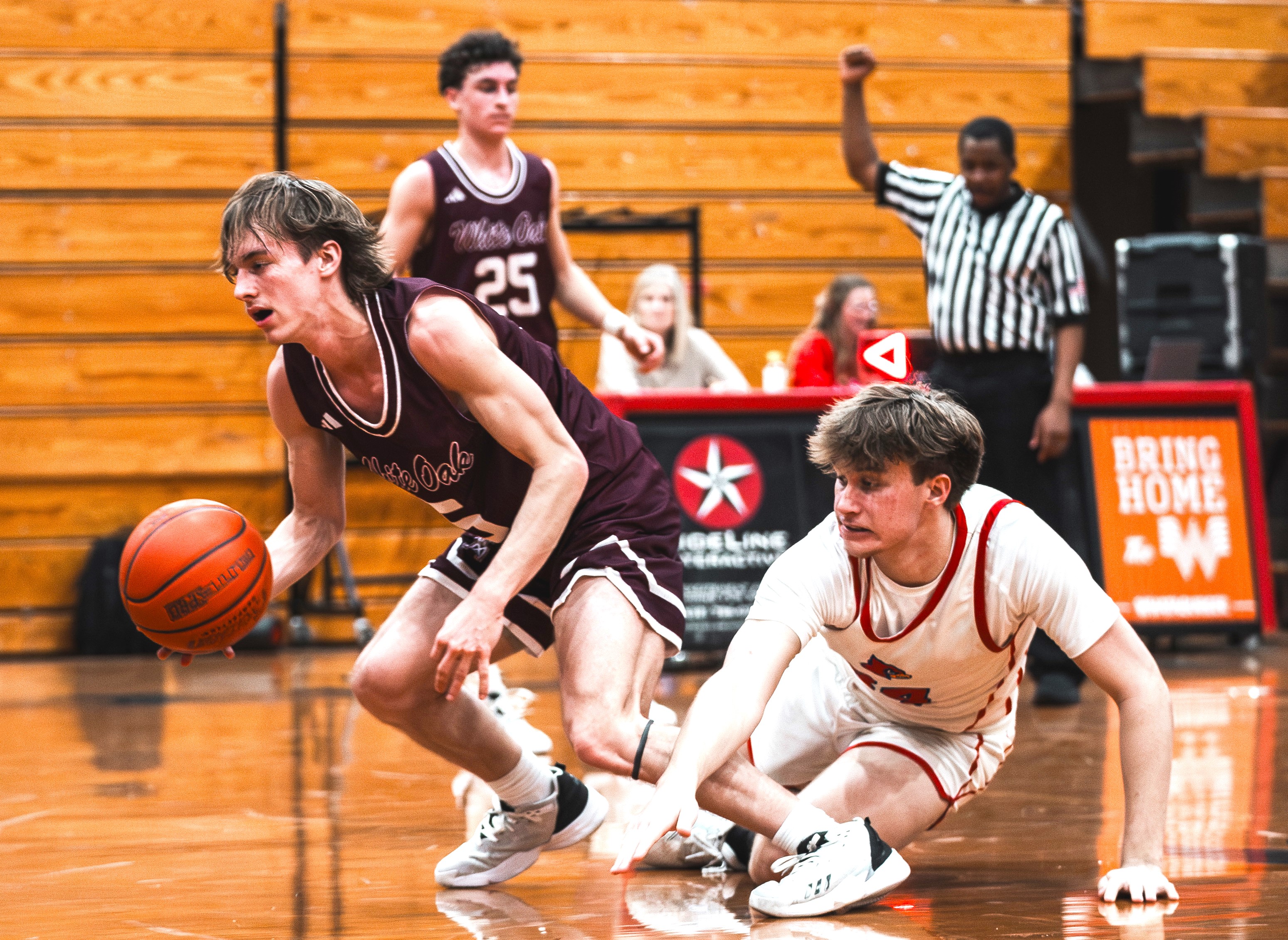 Sabine's Colt Sparks (right) plays defense against White Oak in a District 16-3A game earlier in the season. The Cardinals' season came to an end, though, on Thursday night in Longview in the second round of the Class 3A playoffs in a 45-37 loss to Winnsboro. (File photo by ALEX NABOR -ETBLITZ.COM)