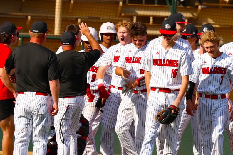 Kilgore sophomore Colt Bullard (center) shouts as he's congratulated by his coaches and teammates after hitting a grand slam against the Gilmer Buckeyes in a District 17-4A game at Driller Park on Tuesday afternoon. Kilgore won a wild one, beating the Buckeyes, 16-13. (Photo by DENNIS JACOBS - ETBLITZ.COM)