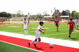 Kilgore freshman Christian Cedillo (foreground) put it in the net twice against Tatum and had an assist in that game in the final full week of the regular season. But it's playoff time now, though, and both Kilgore teams are home Tuesday night against Lufkin Hudson. The Lady Bulldogs will face Hudson at 5:30, the boys to follow, with the Hi-Steppers performing at halftime of one game, and a scrimmage by Kilgore Soccer Association players at the other. (Photo courtesy of KILGORE HIGH SCHOOL BOYS SOCCER)