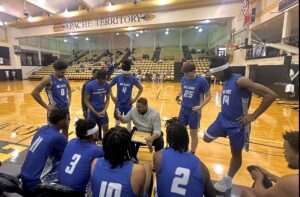 Kilgore College's men's basketball team listens as coach Robert Byrd (center) talks during a first-half time out. The Rangers smoked Bossier Parish early, going up 43-18 by halftime, and then put it in cruise control for a 78-65 victory in the first round of the Region XIV Men's Basketball Tournament at Tyler Junior College. The men's and women's conference tournaments are being played there all week, with both championship games set for Saturday. KC's men are back in action Thursday at 3 p.m. against Blinn, and former KC coach Scott Schumacher; the Lady Rangers play Panola College on Wednesday night at 8 p.m. (Photo by ANNETTE WILEY - ETBLITZ.COM)