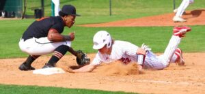 Kilgore's Tanner Beets (right) beats an attempted pick-off throw back to first base against Gilmer. The Bulldogs beat Gilmer, 16-13, in this game at Driller Park a few weeks ago. There's a pair of rematches Tuesday night in Gilmer, a 7 p.m. start (after the junior varsity game), and then again at Driller on Friday. (Photo by DENNIS JACOBS - ETBLITZ.COM)