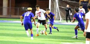 Kilgore's Javier Baide (center, 12) is pictured here in the Bulldogs' battle with Jacksonville earlier this week. KHS plays today at 11 a.m. against Panther Creek at CHRISTUS Trinity Mother Frances Rose Stadium in Tyler, and the winner represents 4A Region II in next week's UIL State Tournament. (Photo by DENNIS JACOBS)