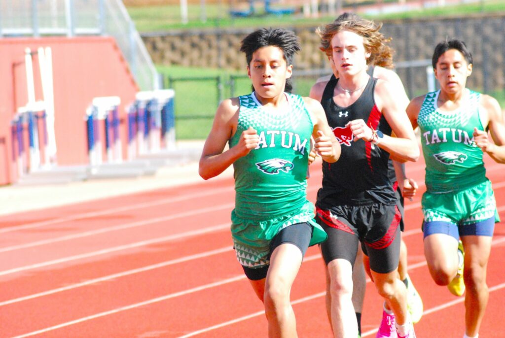 Tatum's Victor Cantellano (foreground) finished second in the mile run and third in the two-mile on Thursday in the UIL District 15-16 Area Meet at West Rusk High School in New London. All of the top-four finishers at the meet move on to the Region II meet next weekend at Whitehouse High School, where they'll try for a top-two finish that would send them to the state meet in Austin May 2-4. (Photo by MITCH LUCAS - ETBLITZ.COM)