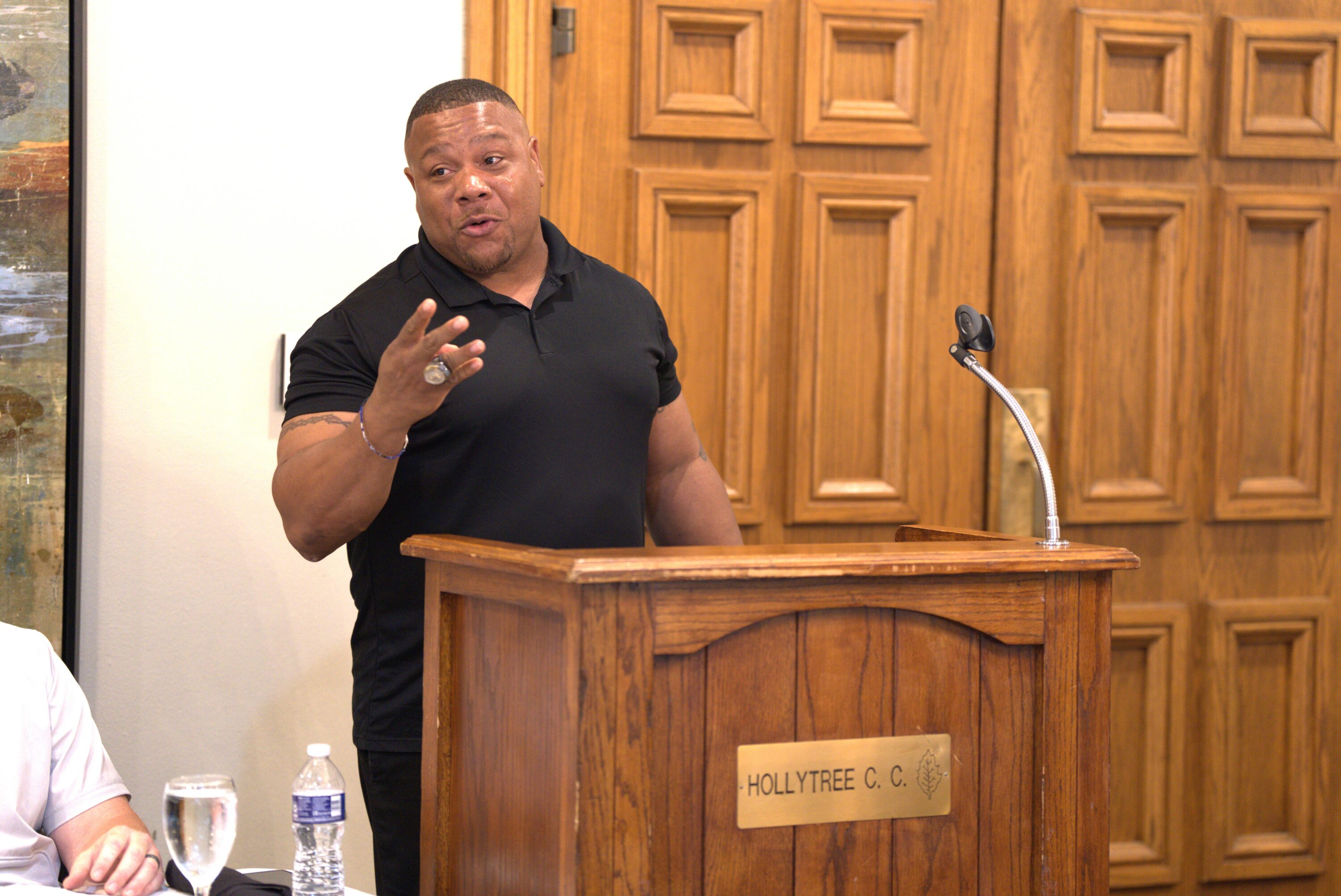 Kilgore College head football coach Willie Gooden talks to the media and the other coaches at Southwest Junior College Football Conference media day on Thursday, July 25 at Hollytree Country Club in Tyler. Below: the room just after the event concluded, prior to lunch. (Photos by MITCH LUCAS - ETBLITZ.COM)