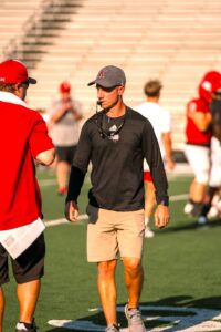 Football practice begins across the state of Texas on Monday, and that means intensity. No one that we know is more intense than Kilgore High School coach Clint Fuller (above), who has led the Ragin' Red four rounds deep into the UIL Class 4A, Division I playoffs the last two seasons, and to two outright district championships in three seasons as head coach. ETBlitz.com is proud to cover all of its area high schools, and that would be Kilgore, Henderson, Sabine, Gladewater, White Oak, Tatum, West Rusk, Arp, Troup, Overton, and Leverett's Chapel. And we also cover Kilgore College athletics, as well. (File photo by MITCH LUCAS - ETBLITZ.COM)