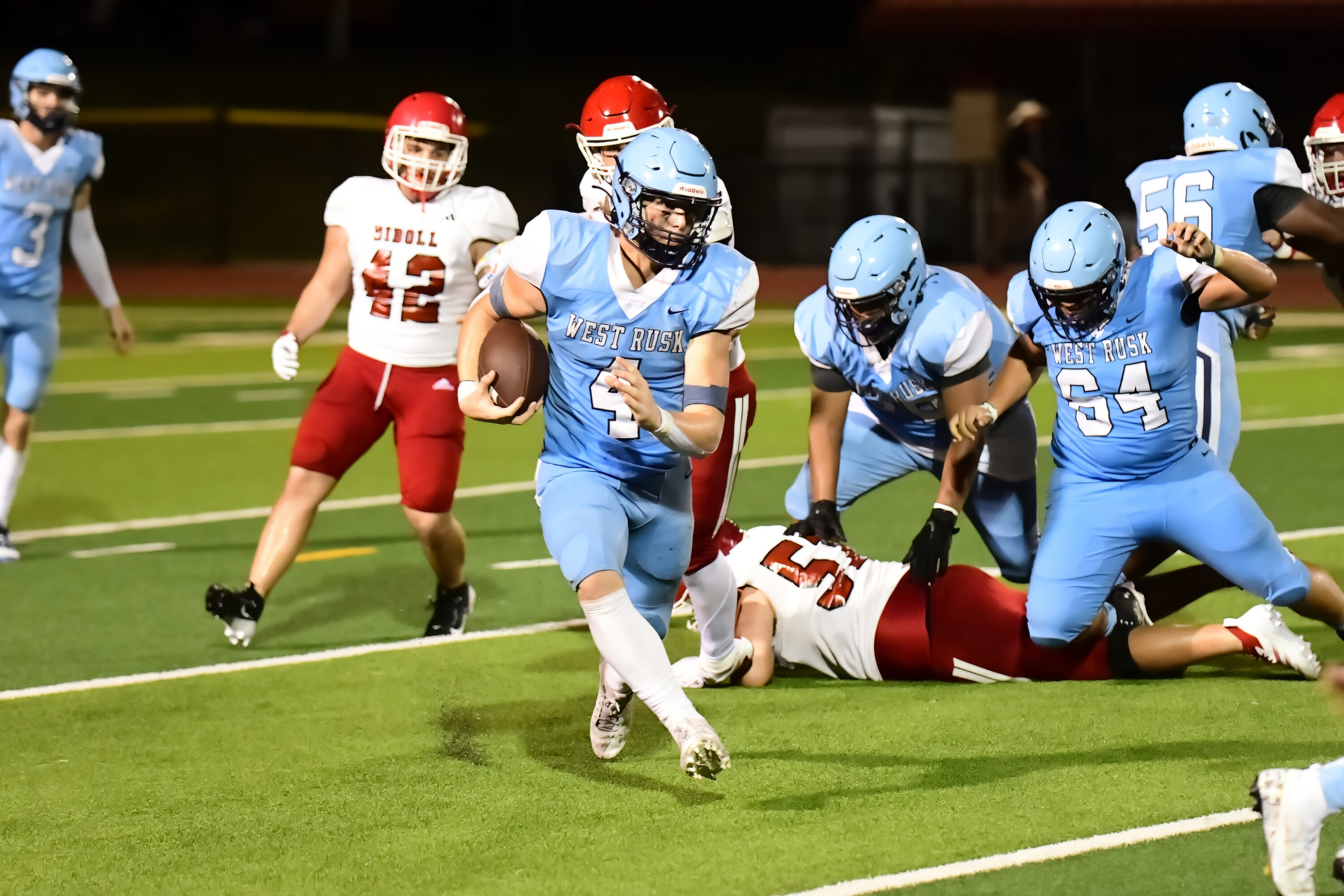 West Rusk's Hunter McCandless (above, 4) looks for running room against the Diboll defense at Bruce Bradshaw Stadium on the West Rusk campus in New London Friday night. Below: quarterback Judson Dodson looks to throw. West Rusk's Raiders beat Diboll, 32-13, on Friday, and will host Gladewater on Thursday night. (Photos by RONNIE SARTORS - SPORT SHOT PHOTOGRAPHY - ETBLITZ.COM)