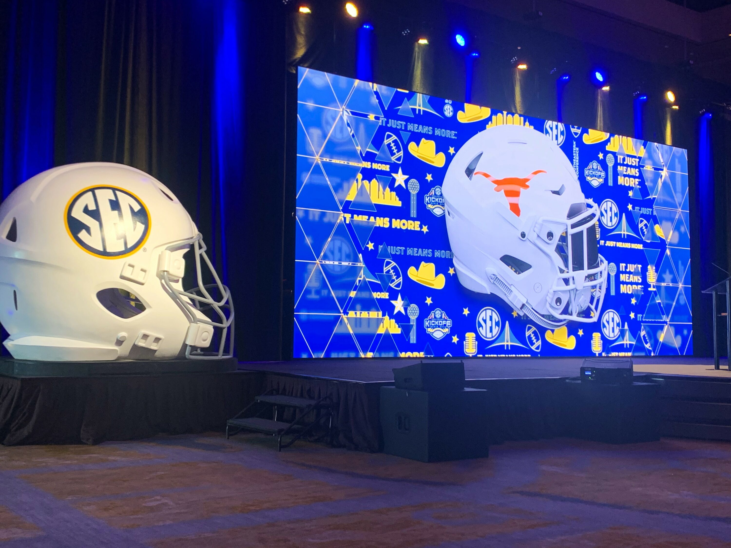 No, this isn't the Twilight Zone. That really is the Texas helmet on an SEC backdrop. It's 2024, after all, and Texas and Oklahoma are now in the Southeastern Conference. And the SEC is holding its annual media days at The Omni in Dallas, as odd as that sounds. (Photo by MITCH LUCAS - ETBLITZ.COM)