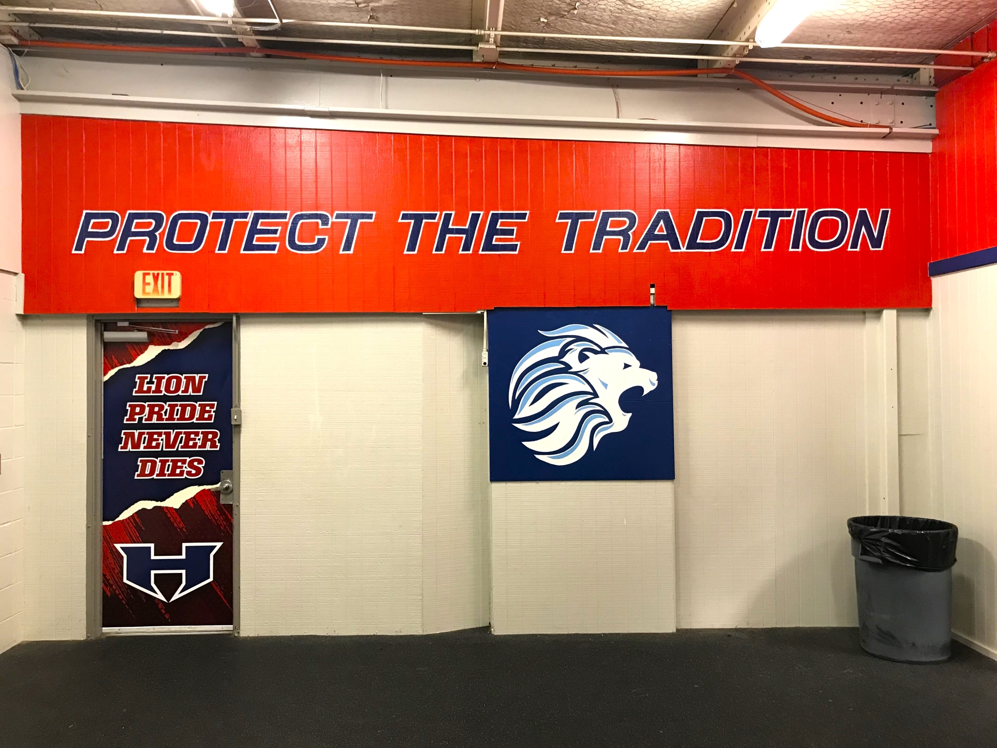 This wall delivers a distinct message that every Henderson athlete gets: LION PRIDE NEVER DIES. Henderson High School football coach Clay Baker (below), himself a former Lion, is re-instilling that in his football team each and every day, planning a return to playoff glory. (Photos by JOE HALE - ETBLITZ.COM)