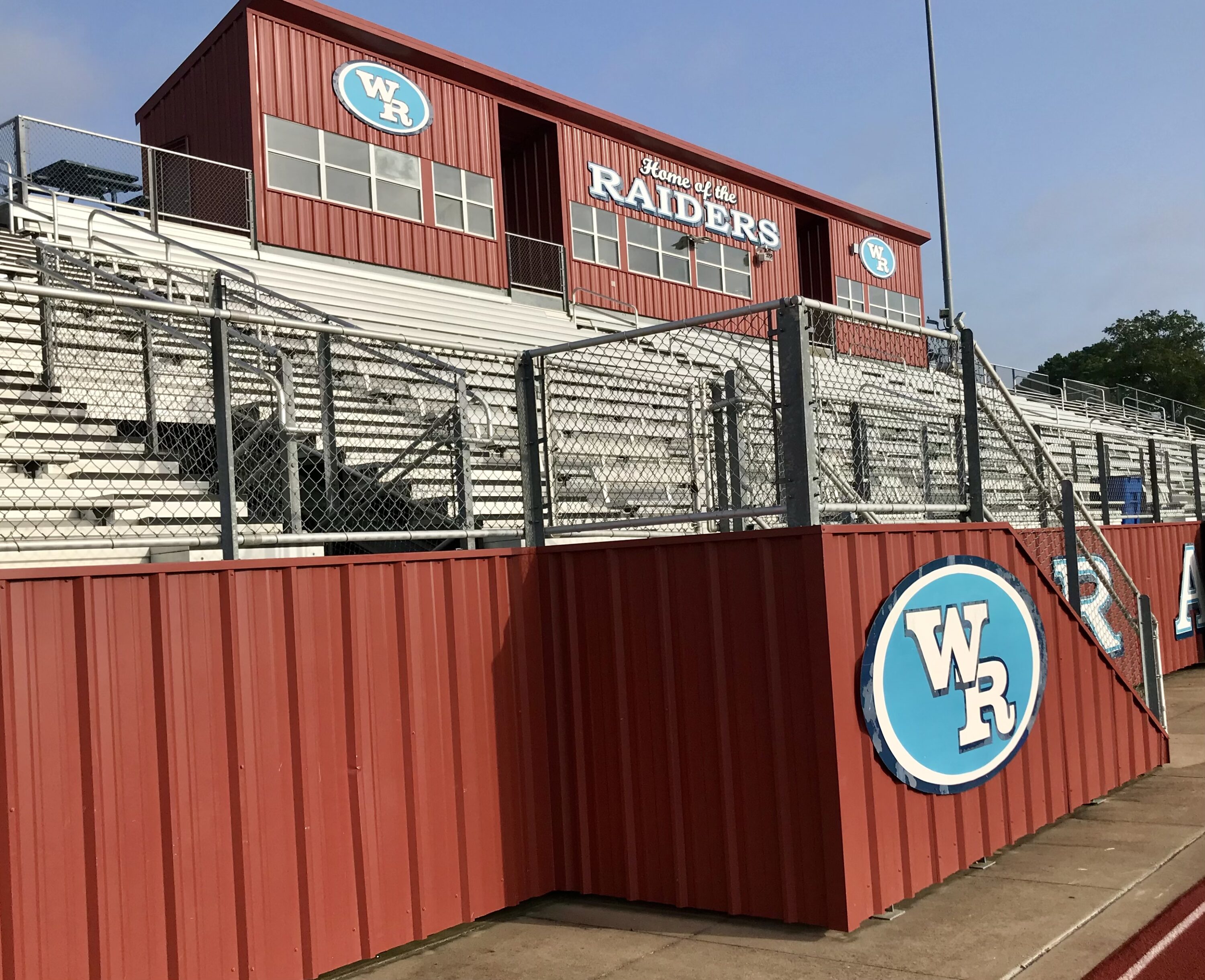 The stands at Bruce Bradshaw Stadium will be full pretty soon, with fans hoping to see West Rusk claim a fifth district title in six seasons. The Raiders open up the 2024 season, coach Rafe Mata's second at the helm, on August 30 at Malakoff. Below: coach Rafe Mata, and the 2024 version of West Rusk's helmet. (Photos by JOE HALE - ETBLITZ.COM)