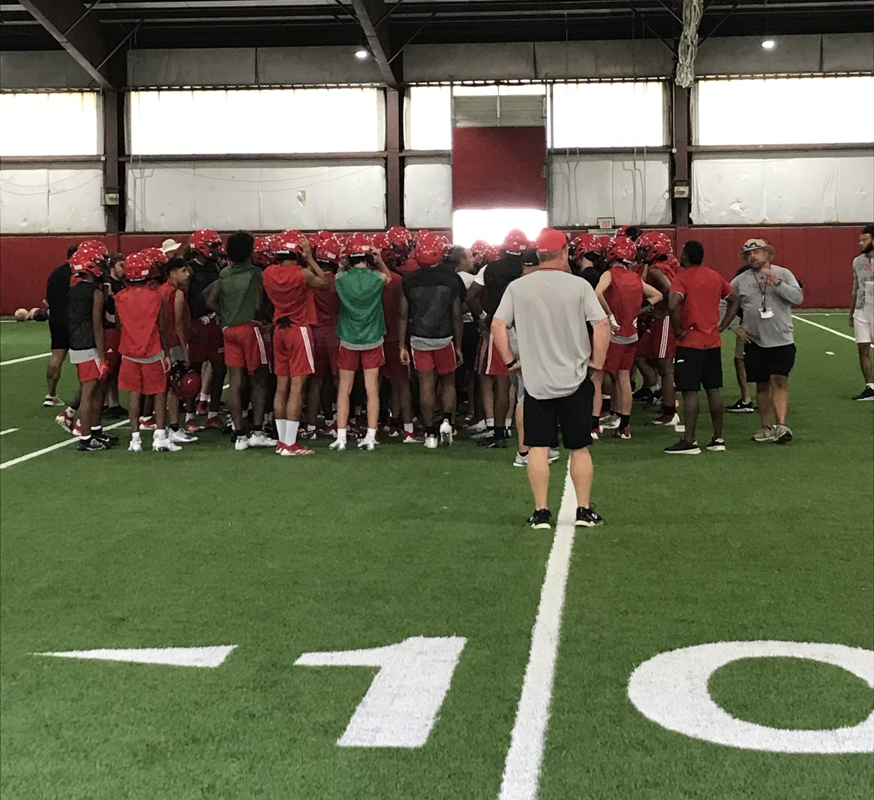 The Kilgore High School Bulldogs meet briefly in their indoor practice facility on Monday, the first day that Texas high school football teams could begin practicing. (Photo by JOE HALE - ETBLITZ.COM)