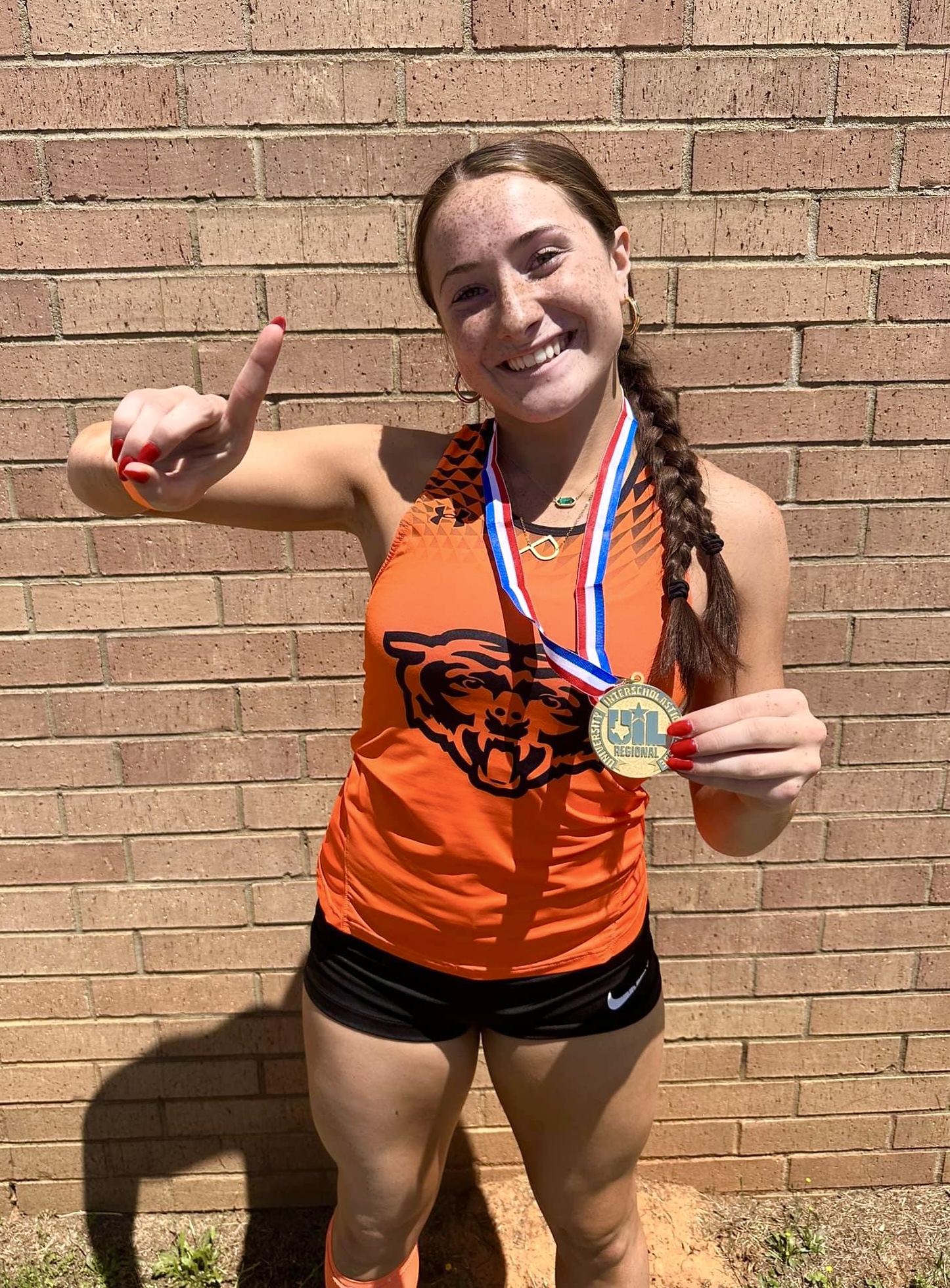 Gladewater's Peyton Hunter, pictured here after winning the 100 meter dash at the regional meet at Whitehouse. Hunter won something bigger than that: she won two SILVER medals at the UIL State Track & Field Championships in Austin last week! Peyton and Kilgore's Braydon Nelson (pictured below, on the medal stand) are this week's Whataburger / ETBlitz.com Players of the Week! (Above photo courtesy of GLADEWATER ATHLETICS FACEBOOK PAGE; photo below courtesy of T.J. GILLEN-HALL)