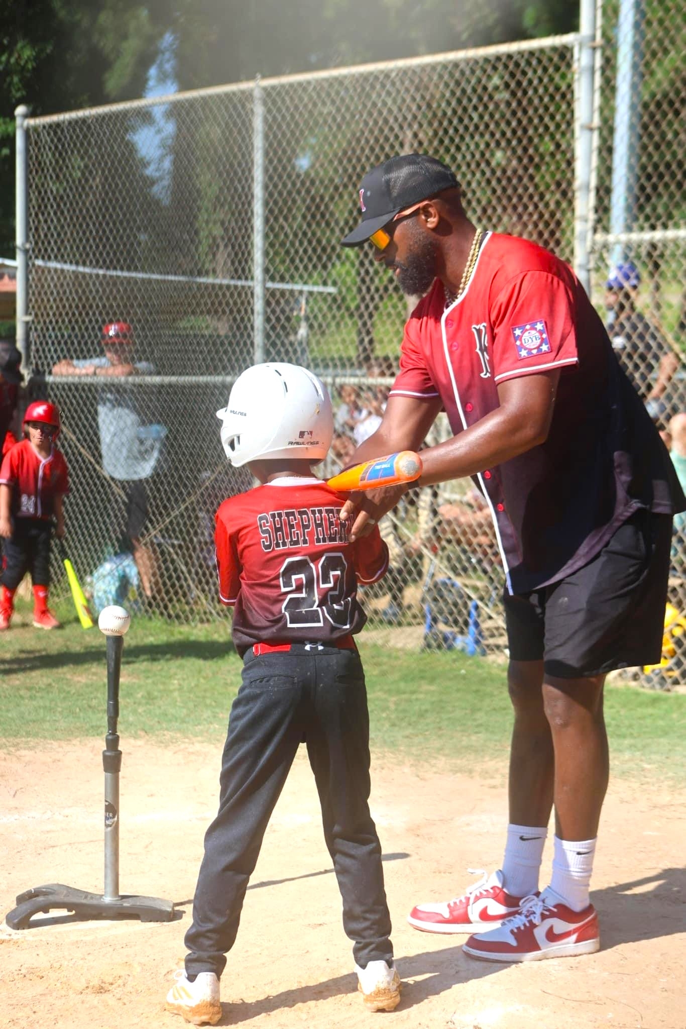 Kilgore T-Ball All-Star Jaylen Shepherd (23) gets some instruction before an at-bat from a familiar coach, Jaron Shepherd. This photo is by Renita Dickey from Twinn2 Photography, and see more of her work on her Facebook page of that same name! (Photo by RENITA DICKEY - SPECIAL TO ETBLITZ.COM)