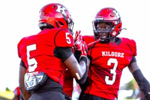 Kilgore's Jayden Sanders (right) and Isaiah Watters celebrate after a play during the 2023 season. Sanders has quite a list when it comes to college suitors: 19 of them, and growing, it seems, and has a pretty heavy decision coming. (Photo by ALEX NABOR - ETBLITZ.COM)