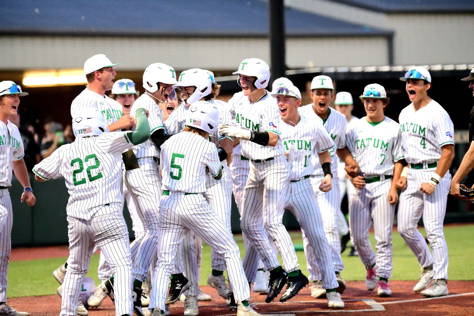 Tatum senior Carson Gonzalez gets mobbed by his teammates after hitting a grand slam against West Rusk Friday in the Eagles' 7-4 win. Tatum advances to the UIL Class 3A Regional Semifinals for a second straight season. (Photo by RONNIE SARTORS - SPORT SHOT PHOTOGRAPHY - ETBLITZ.COM)