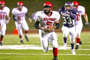 In a scene from the ages, former Kilgore High School running back Keith Gilliam (5) outruns everybody to the end zone in a game against Port Neches-Groves, a legendary playoff game at Stephen F. Austin that occurred in the middle of the night after a series of thunderstorms. Kilgore would go on to finish the season 16-0, winning the UIL Class 4A, Division II state championship. There's a special reunion planned on Sept. 20. You're invited. (Photo by KATHY BOWDEN)